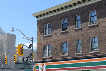 Obraz premium exterior building side and sign of 7-Eleven, a convenience store chain, located at 334 Bloor St W at Spadina, Toronto