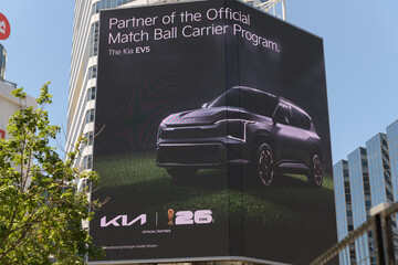 Obraz premium Kia digital advertising at Sankofa Square for their EV5, a compact electric SUV, Toronto