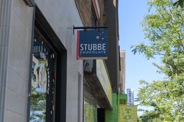 Obraz premium touch defocused exterior building facades and signage outside Stubbe Chocolate located at 653 St Clair Av W, Toronto