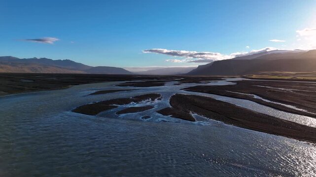 Low altittude drone flight over Braided Glacial River in Iceland Landscape at Stora Dimon in a clear day