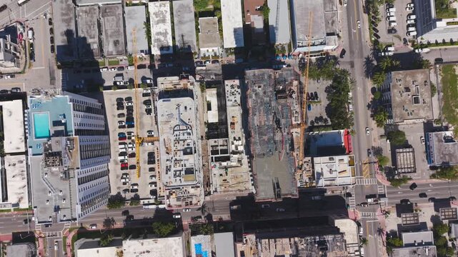 Top down aerial view of a building construction site with rebar and scaffolding