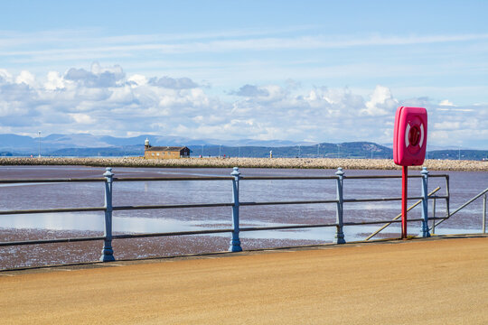 The Stone Jetty Breakwater in Morcambe Bay in the North West of Englandl ooking across the sand and mudflats