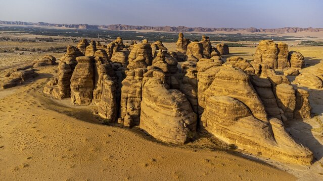 Aerial of beautiful rock formations in the Unesco site Maidain Saleh or Hegra, Al Ula, Kingdom of Saudi Arabia