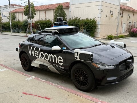 Waymo autonomous self driving vehicle wrapped in black with a soccer ball and Welcome for the FIFA World Cup 2026 in Los Angeles, California