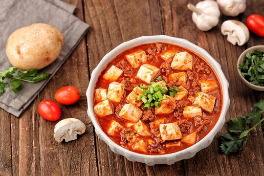 Szechuan mapo tofu in ceramic bowl for spicy Chinese cuisine 
