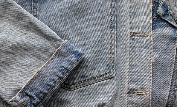 Detail view of denim jacket opening and pocket