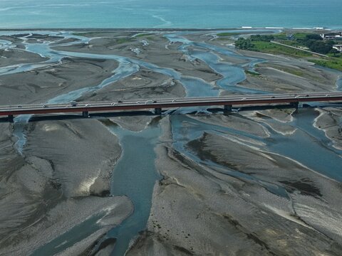 Aerial drone photo of Abekawa River mouth braided river and bridge, Shizuoka, Japan