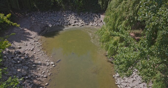 Dry riverbed showing drought conditions with low water
