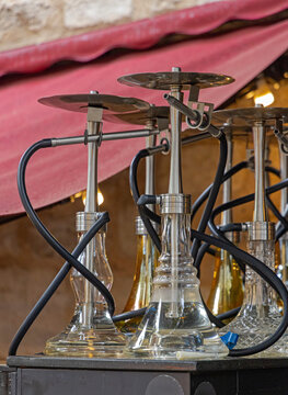 Glass Hookahs Water Pipe Shisha Narghile Collection at Bar Table