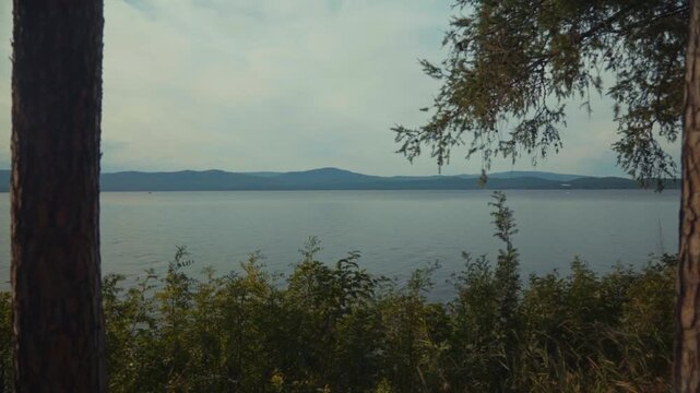 Beautiful view of the mountain lake. Smooth arrival of the camera