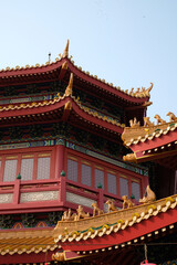 Obraz premium Close-up of an ornate temple facade featuring layered roofs and colorful traditional architectural details.