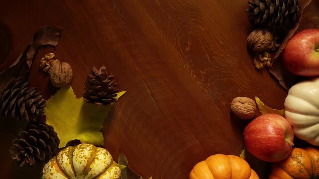 Empty center wood surface framed by pumpkins and leaves for text overlay warm vignette, scattered nuts and pinecones, clean negative space ideal for poster or social media header