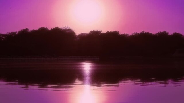 Dreamy synthwave aesthetic landscape of sun reflecting on water surface with magenta sky