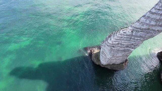 Drone flyby of the &Eacute;tretat sea stack and limestone cliffs, Normandy, France