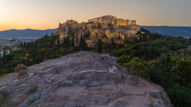 Sunrise over the Acropolis and Areopagus aka Mars Hill in Athens, Greece. The quiet morning is beautiful and calm. There is a sense of spirituality over the historic and iconic landmark in Europe. 