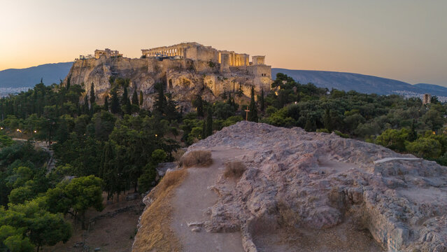 Sunrise over the Acropolis and Areopagus aka Mars Hill in Athens, Greece. The quiet morning is beautiful and calm. There is a sense of spirituality over the historic and iconic landmark in Europe. 