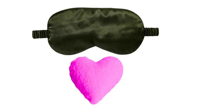 Dark green sleep mask with pink heart shaped pillow isolated on transparent