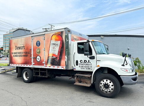 NORWALK, CT, USA - JUNE 26, 2026: White box truck transporting goods for C.D.I.
