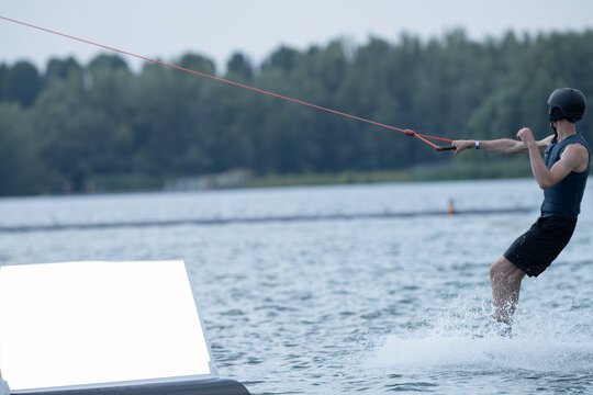Man Wakeboarding On Hot Summer Day