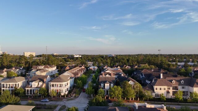 Large mansion houses with swimming pool, in affluent neighborhood metroplex, expensive suburban homes surrounding by lush green trees, aerial view, Texas, USA