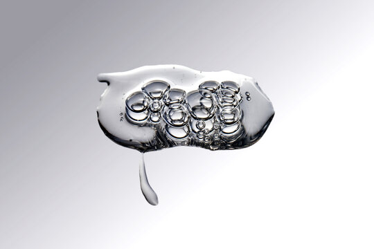 Clear gel serum with bubbles showing cosmetic texture