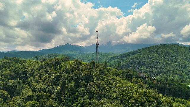 Rustic cottages and upscale mountain residences surrounded by forest canopy and dramatic landscapes in a serene countryside setting