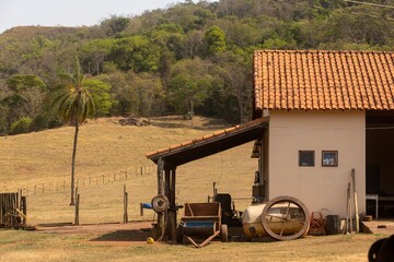 Traditional farmhouse surrounded by dry pastures and native Cerrado vegetation during the dry season in Costa Rica, Mato Grosso do Sul, Brazil. © moreira193