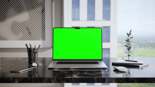 Laptop Green Screen Mockup on Desk in Modern Executive Office Interior - Front View
