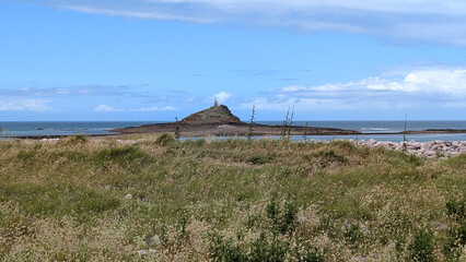 Ilot Saint-Michel at low tide with Chapel of Saint-Michel in the distance, Erquy, Brittany, France.  © Inha