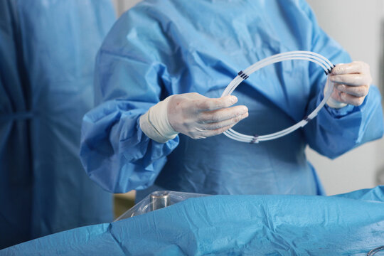 Elimination of blood clots. Hands surgeon. Surgical interventions on blood vessels. Vascular endovascular surgery.Concept of health care.