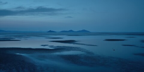 Fototapeta premium Evening light on the water near remote islands at dusk