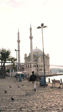 Male Traveler Exploring Ortakoy Mosque by the Bosphorus