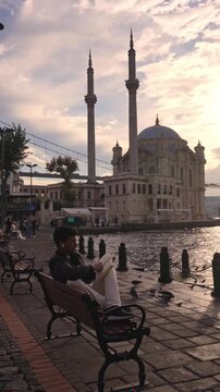 Young Traveler Enjoying Bosphorus Waterfront in Ortakoy Istanbul