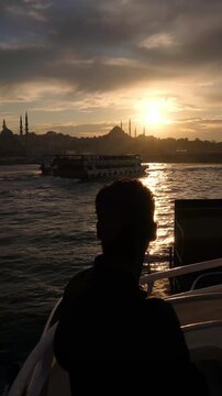 Back View of Man Traveling by Ferry in Istanbul Turkey