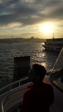 Male Traveler Watching Sunset Over the Bosphorus in Istanbul
