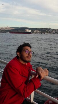Man Traveling by Ferry Across the Bosphorus in Istanbul