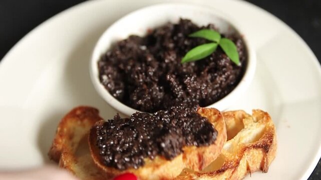 Olive tapenade appetizer black olive p&acirc;t&eacute; food preparation tasty snack fresh and delicious gourmet food background on the table rustic food top view copy space