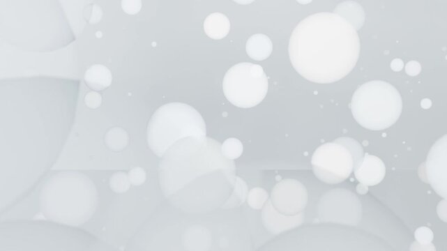 Bright white frame fading soft bokeh circles expanding on gray backdrop creating depth with sparks