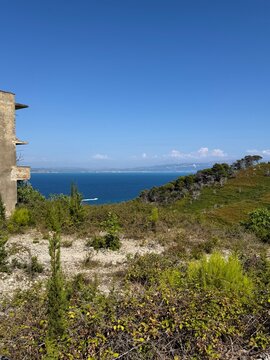 Abandoned military building surrounded by wild nature on Sazan Island in Albania with a beautiful sea view