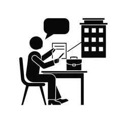 Fototapeta premium Consultant sits at a desk while reviewing architectural building plans for a new development.