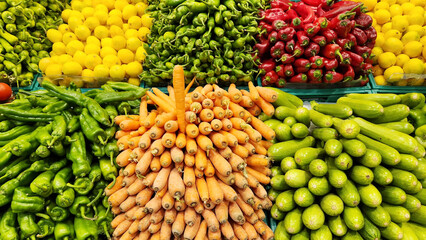 Fresh fruits and vegetables arranged in crates in the fruit and vegetable section. © cagatay