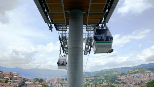 Medell&iacute;n, Antioquia, Colombia &ndash; June 30, 2026 &ndash; Metrocable cable cars crossing hillside neighborhoods as part of the city's urban public transportation network