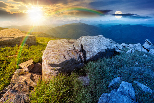 mountain landscape with grass and rock on a slope. day meet night. view in to the distant valley of carpathian mountains. sun and moon in harmony over mountainous scenery of ukraine on summer solstice