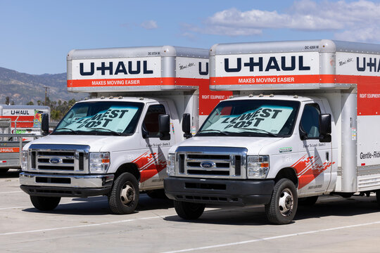 Hemet, California, USA - April 6, 2024: Moving trucks display lowest cost shades on a U-Haul lot.
