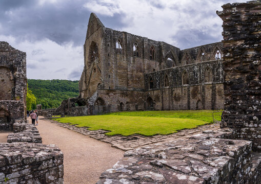 Tintern Abbey, a Cistercian monastery in Wales, features impressive ruins and a rich historical legacy.