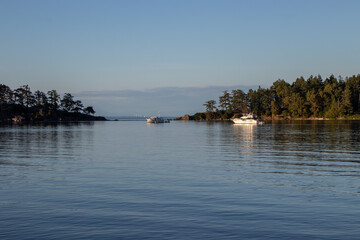 Pleasure boats anchored in a tranquil bay © Lynda Potter