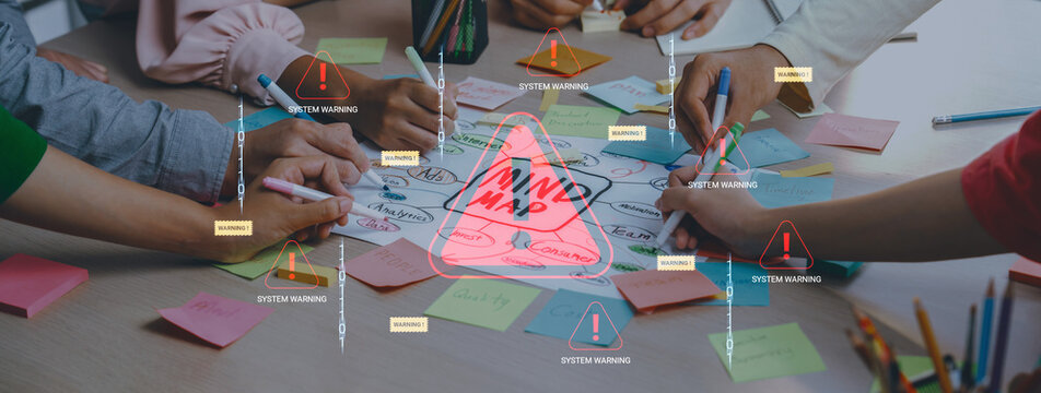Group of Diverse Hands Engaging in Brainstorming Session with Colorful Sticky Notes and Warning Signs Surrounding a Central Idea on a Whiteboard. Glyphic.