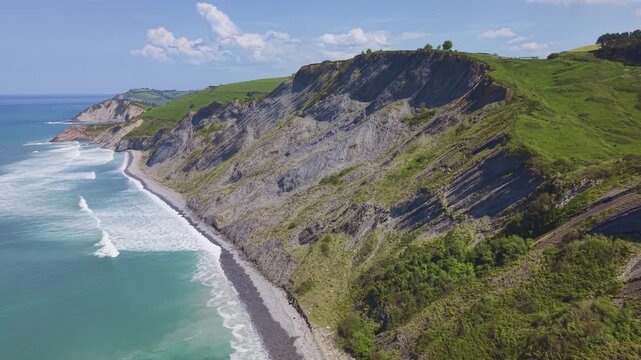 Coastal cliffs and ocean aerial panoramic landscape. Flysch Begiratokia - Baratzazarrak. Deva, Gipuzkoa, Spain.