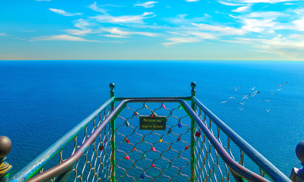 Sea view from the balcony at the famous Victoria viewpoint in Jasmund National Park over the blue Baltic Sea with seagulls and the horizon