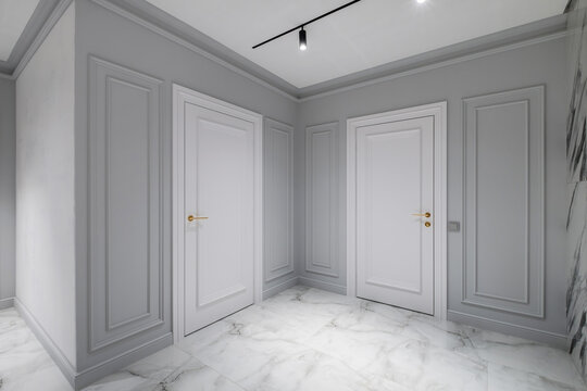 door handle on white wooden door in interior. Knob close-up elements. Door handle, fittings for interior design